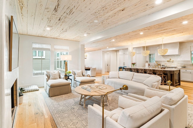 living room featuring wooden ceiling and light wood-type flooring