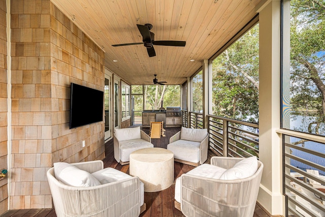 sunroom / solarium with wood ceiling and ceiling fan