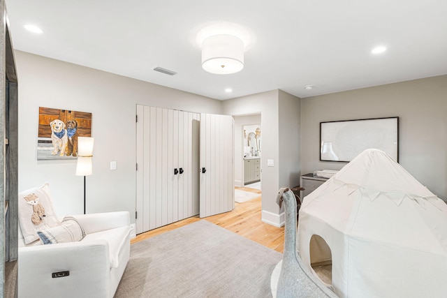 bedroom with light wood-type flooring