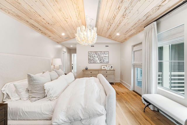 bedroom with a notable chandelier, light hardwood / wood-style flooring, and wood ceiling