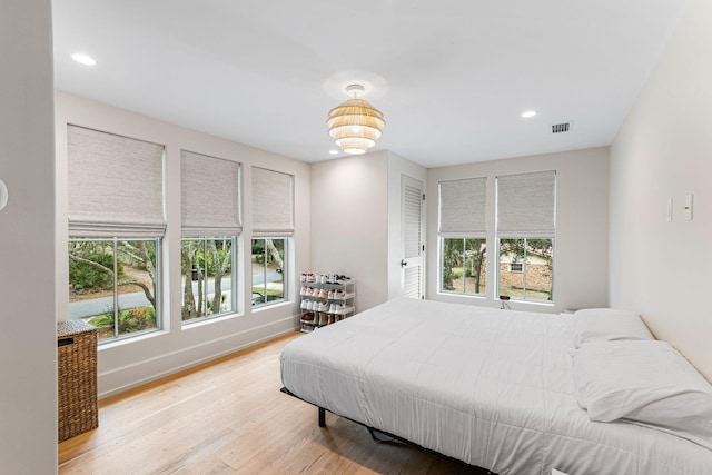 bedroom featuring a closet and light hardwood / wood-style flooring