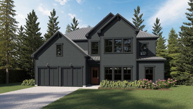 view of front of home with a front yard and a garage