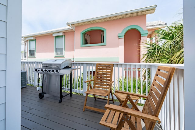 wooden deck featuring area for grilling