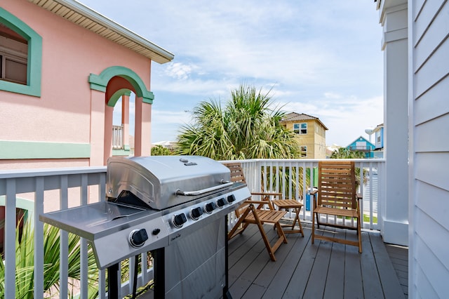 wooden terrace with area for grilling