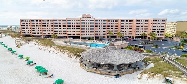 view of building exterior with a community pool