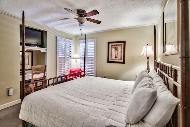 bedroom with dark colored carpet, ceiling fan, ornamental molding, and a textured ceiling