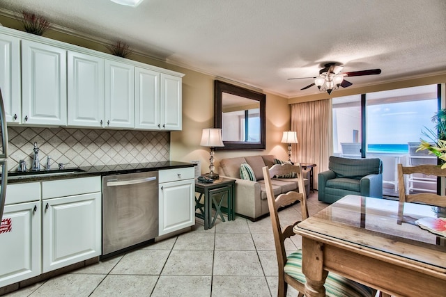 kitchen with ceiling fan, dishwasher, tasteful backsplash, white cabinetry, and ornamental molding