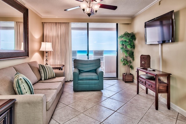 living room featuring ornamental molding, a healthy amount of sunlight, ceiling fan, and a water view