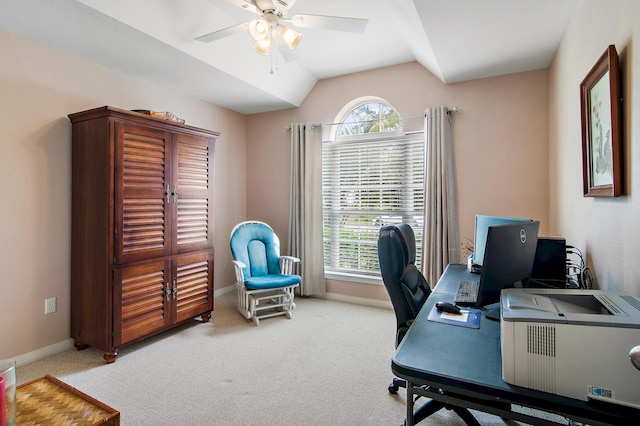 carpeted home office featuring vaulted ceiling and ceiling fan