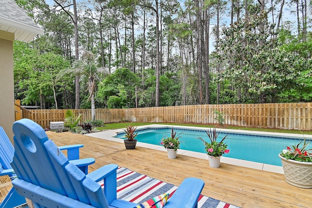 view of swimming pool featuring a wooden deck