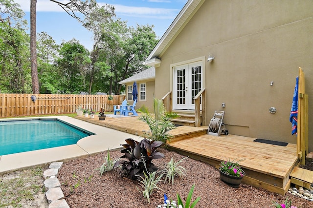 view of swimming pool featuring a deck