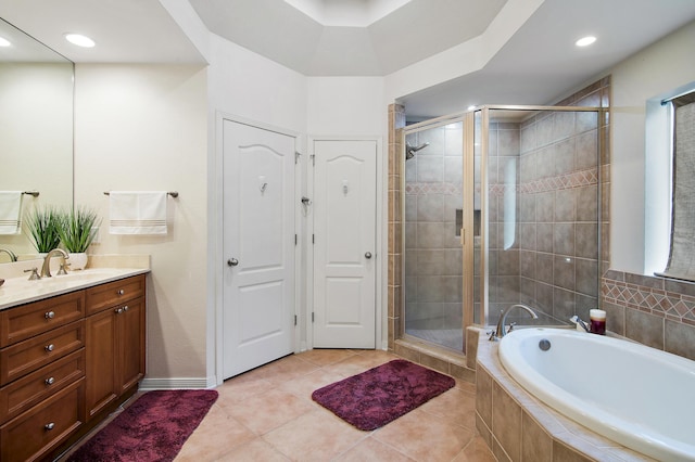 bathroom with vanity, independent shower and bath, and tile patterned floors