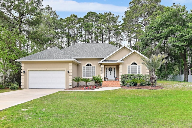 ranch-style house featuring a front yard and a garage