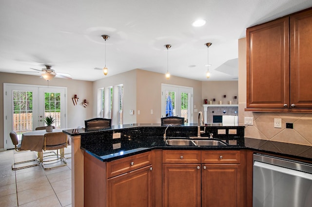 kitchen with french doors, a healthy amount of sunlight, and hanging light fixtures