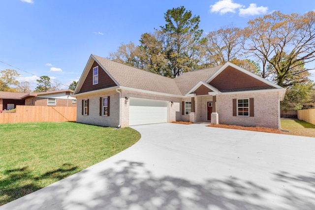 view of front of property featuring a front yard and a garage