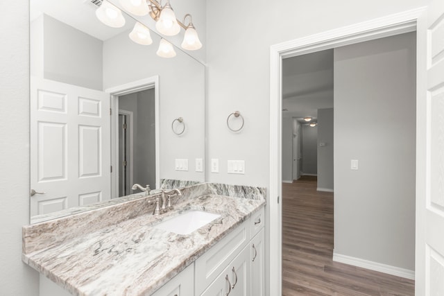 bathroom with wood-type flooring and vanity