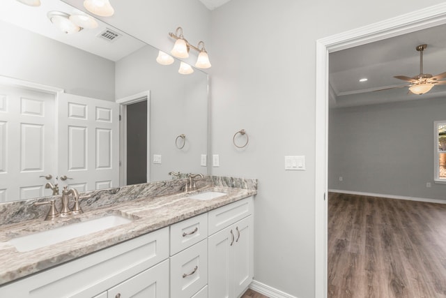 bathroom with ceiling fan, hardwood / wood-style flooring, and vanity