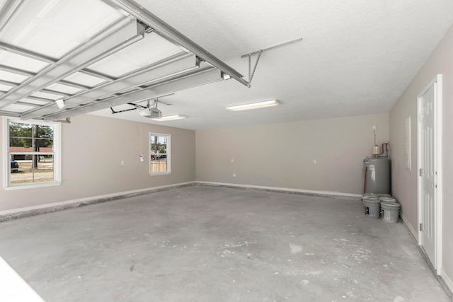 garage with a garage door opener and water heater