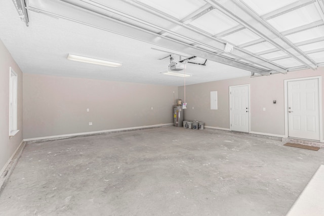 garage with gas water heater and a garage door opener