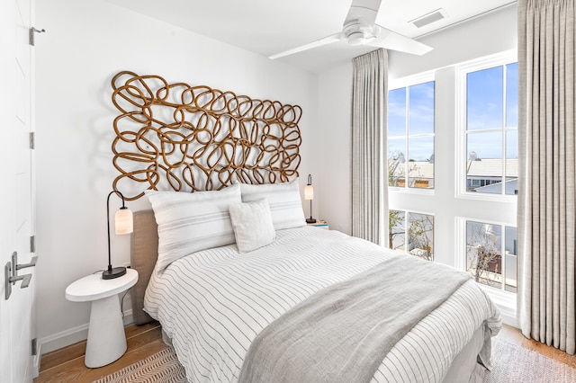 bedroom featuring ceiling fan and light wood-type flooring