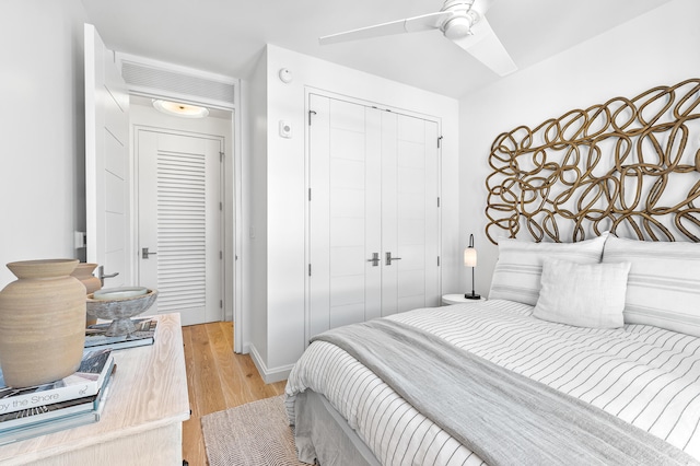 bedroom featuring a closet, ceiling fan, and light hardwood / wood-style floors