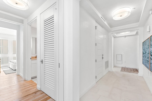 hallway featuring light tile flooring