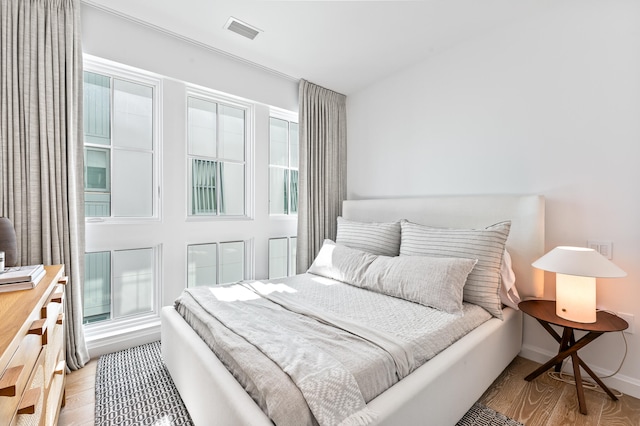 bedroom with light hardwood / wood-style flooring