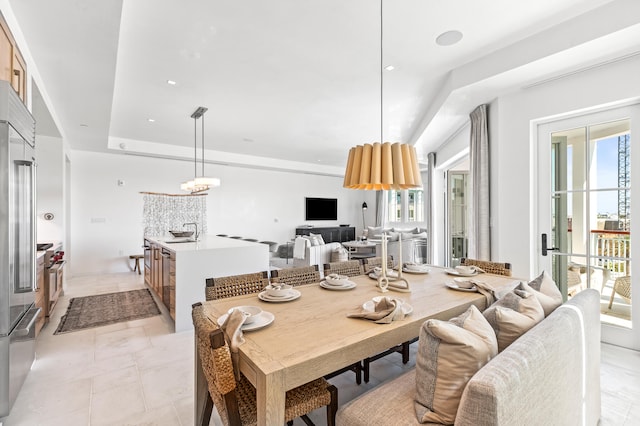 tiled dining space featuring sink