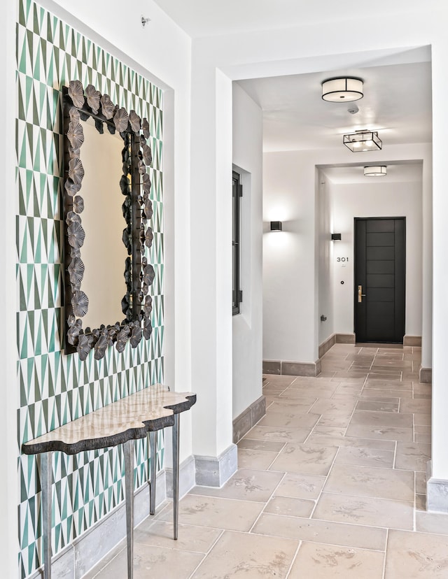 hall with light tile flooring