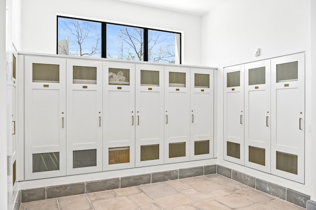 mudroom featuring light tile floors