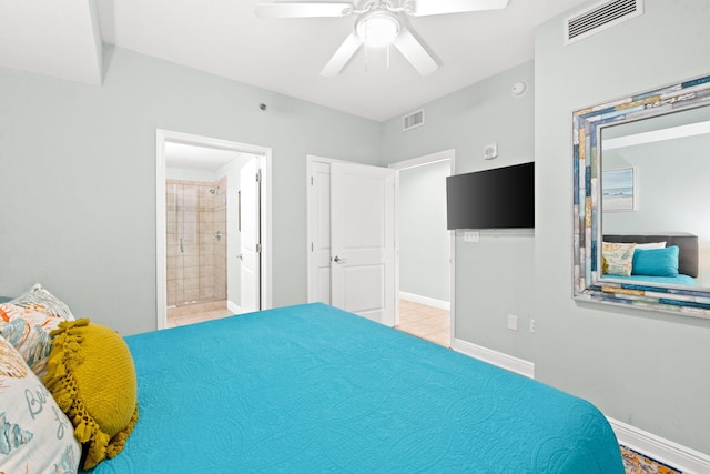 tiled bedroom with ceiling fan and ensuite bathroom