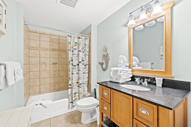 full bathroom featuring tile floors, vanity, toilet, and shower / bath combo with shower curtain