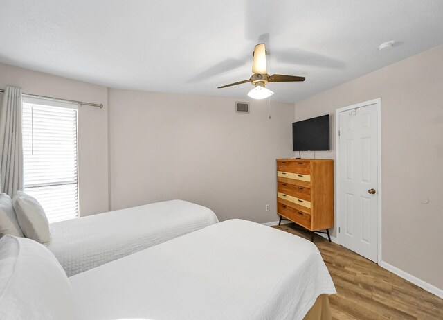 bedroom featuring light hardwood / wood-style flooring and ceiling fan