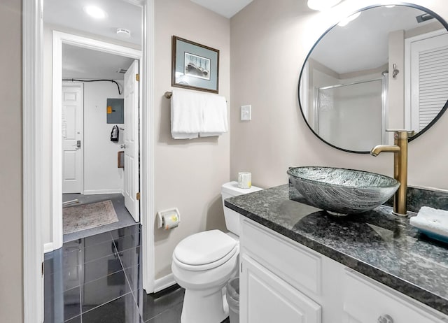 bathroom featuring oversized vanity, tile floors, and toilet