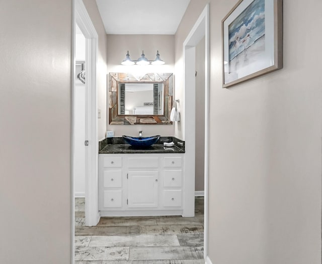 bathroom featuring hardwood / wood-style flooring and vanity