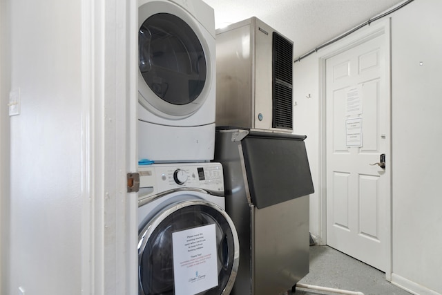 laundry area featuring stacked washer / dryer