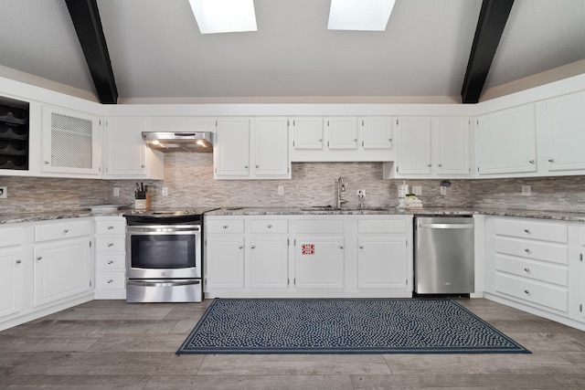 kitchen with white cabinets, sink, stainless steel appliances, and exhaust hood