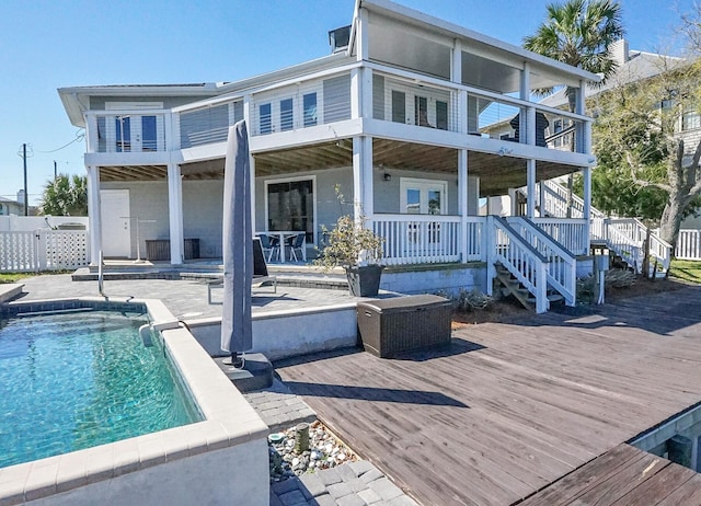 back of house with a patio area and a swimming pool side deck