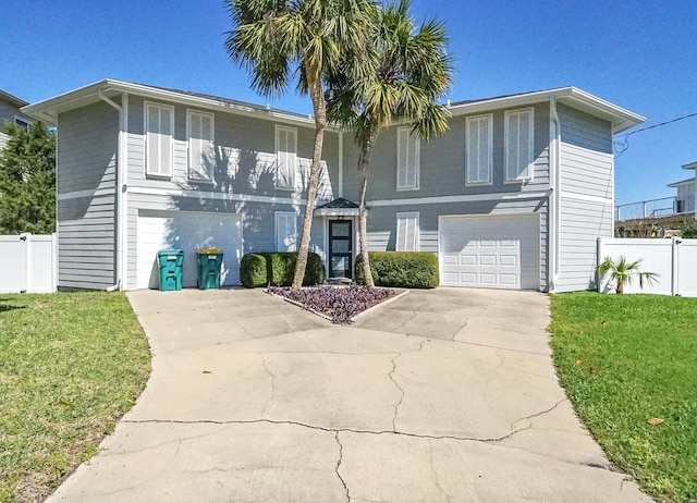 view of front of house featuring a garage and a front yard