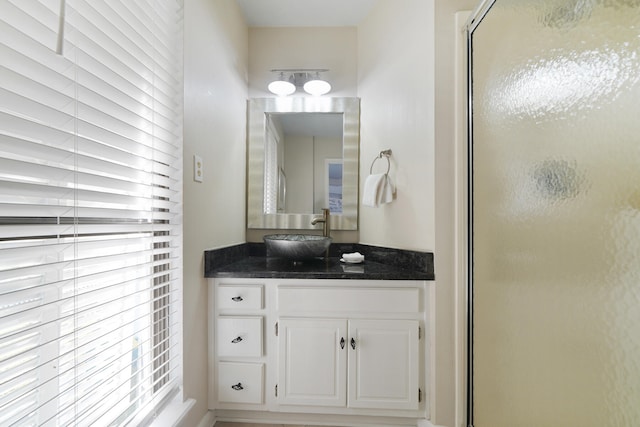 bathroom with a healthy amount of sunlight and vanity