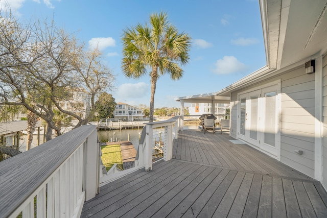 wooden terrace with a water view