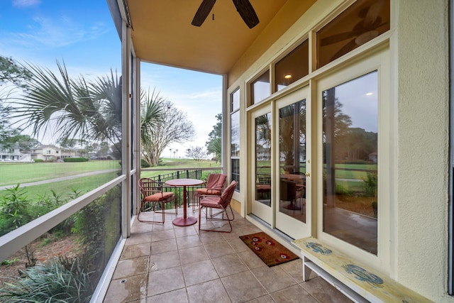 sunroom / solarium with ceiling fan