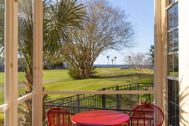 wooden terrace with a lawn