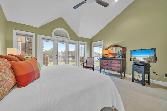 bedroom with ceiling fan, high vaulted ceiling, french doors, light colored carpet, and access to outside