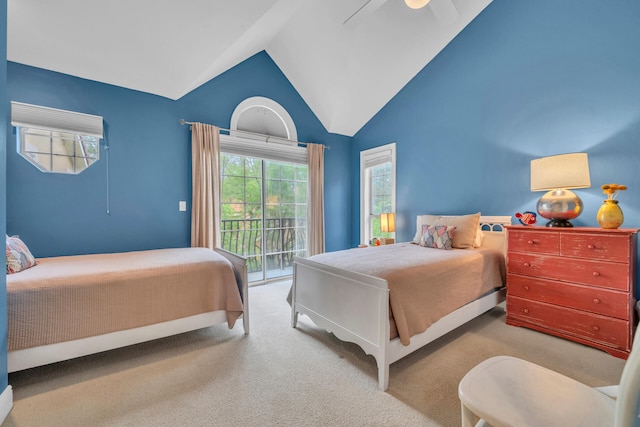 carpeted bedroom featuring access to outside, high vaulted ceiling, and ceiling fan