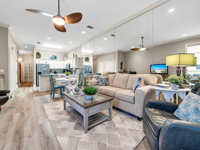 64 Vantage Pt Unit 64, Miramar Beach, FL 32550 - living area featuring a ceiling fan, visible vents, ornamental molding, and light wood finished floors