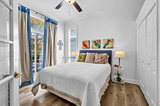 64 Vantage Pt Unit 64, Miramar Beach, FL 32550 - bedroom featuring crown molding, baseboards, wood finished floors, and a closet