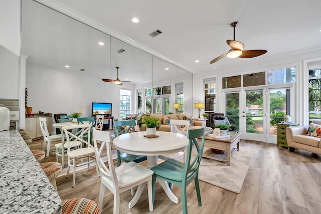 64 Vantage Pt Unit 64, Miramar Beach, FL 32550 - dining room with french doors, ornamental molding, a ceiling fan, and visible vents