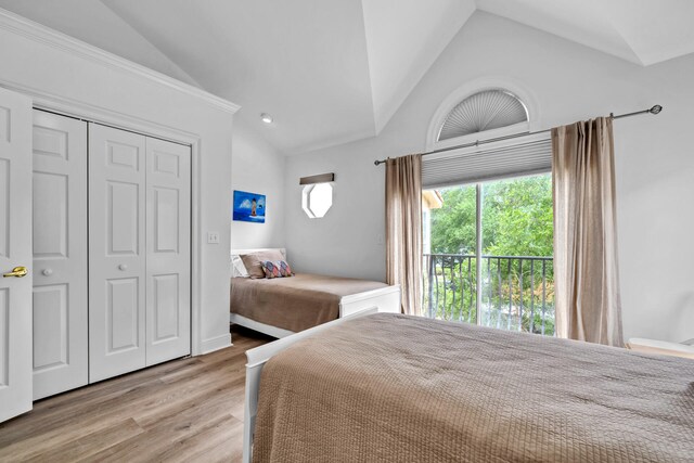 64 Vantage Pt Unit 64, Miramar Beach, FL 32550 - bedroom with light wood-style floors, lofted ceiling, and a closet