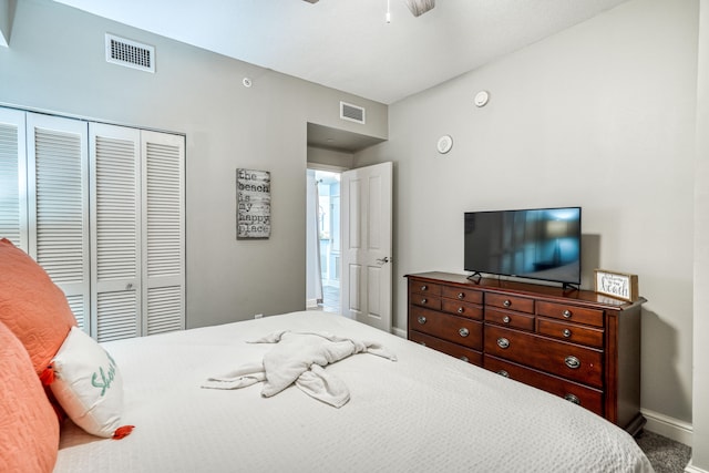 carpeted bedroom with a closet and ceiling fan